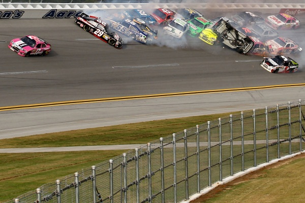 Tony Stewart triggers a huge last lap crash, and Matt Kenseth slips through to win a wild Talladega 500